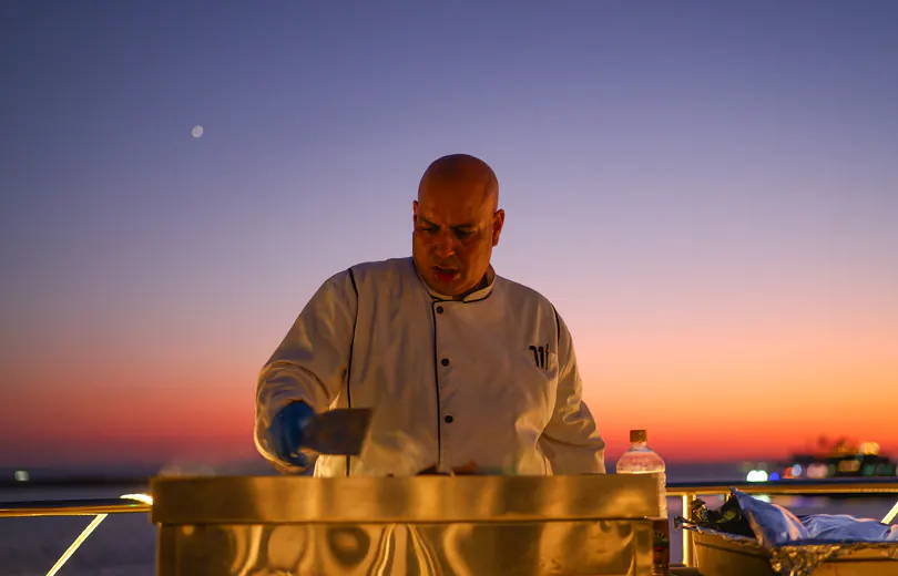 Grilling on deck before sunset